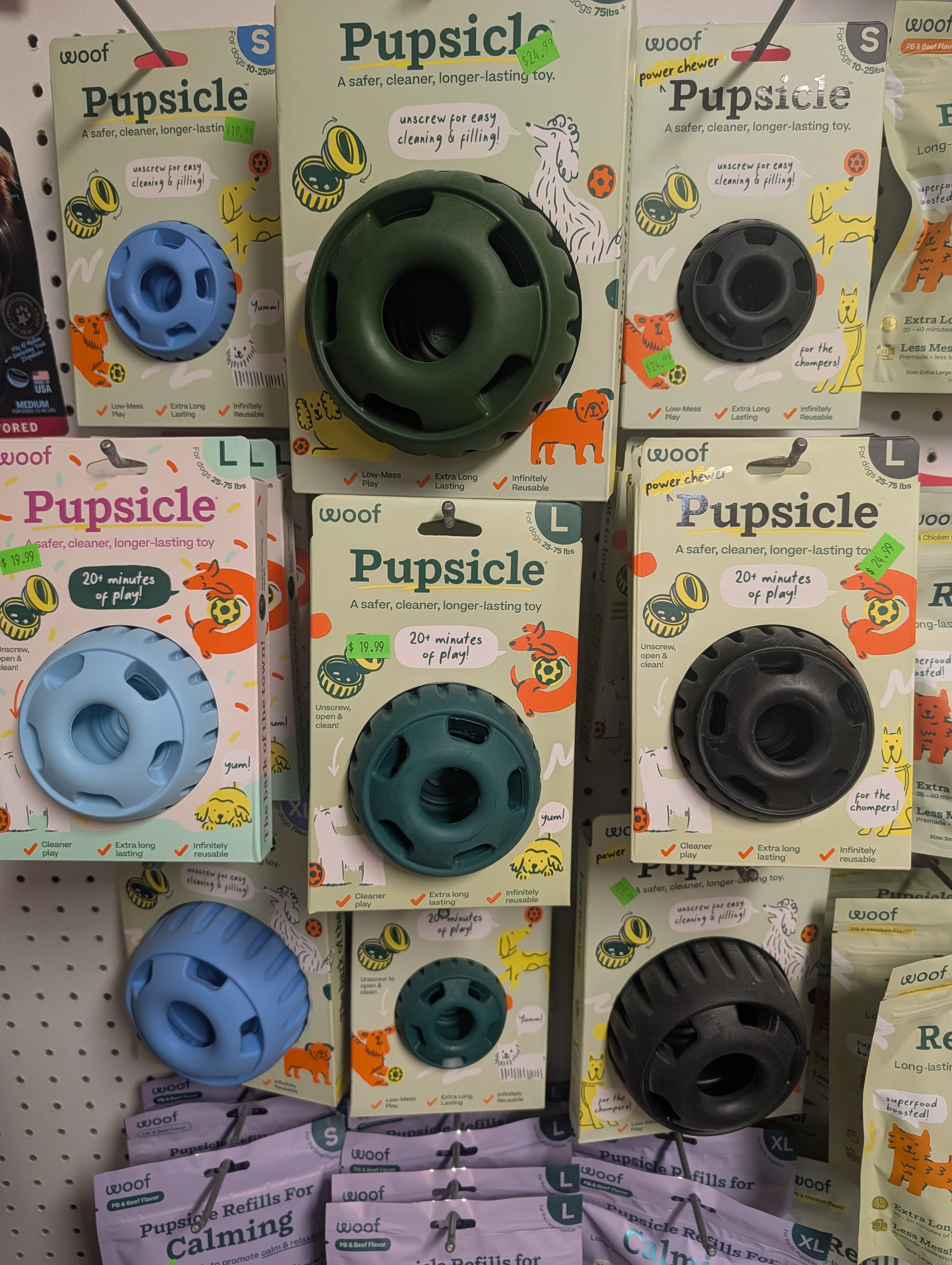 WOOF Pupsicle display — multiple sizes and colors in store